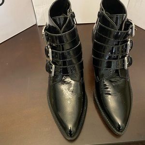 Black patten leather ankle boots with inside zipper.